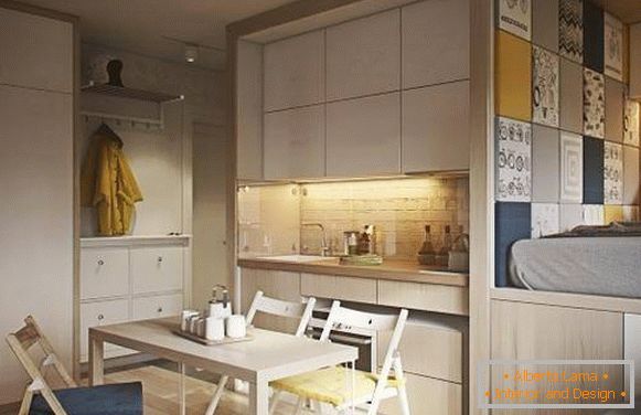 A 40 négyzetméteres egyszobás apartman divatos kialakítása - a konyha és a hálószoba képe