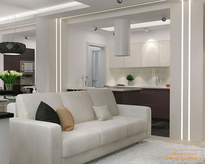 Egy kis nappali a minimalizmus stílusában a stúdióban. A belső tér funkcionalitása és vonzereje ebben a stílusban pótolhatatlanná teszi egy kis lakóterület elrendezését illetően.