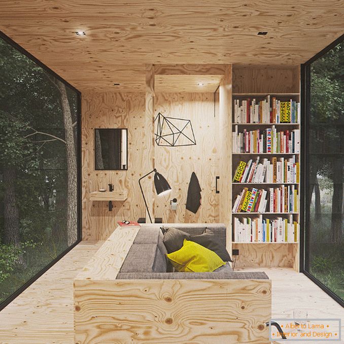 Интерьер маленького домика Tomek Michalski kabin в лесу
